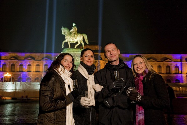 Young people celebrate New Year's Eve on the theatre square in Dresden