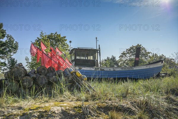 Fishing boat, installation of a fisherman behind the dune, Heringsdorf, Usedom,