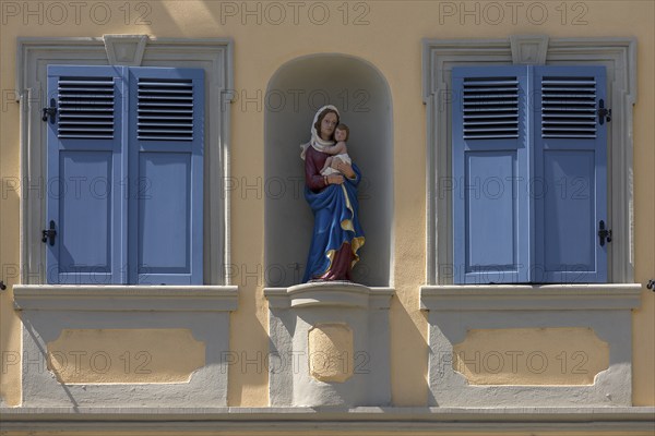 Residential house with Mary's fugue in a niche between two blue shutters, Zeil am Main, Lower
