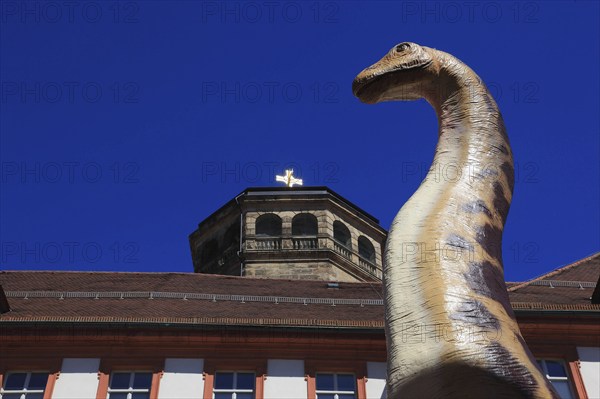 Dinosaur figure in the city centre of Bayreuth, advertising for the primeval world museum in the