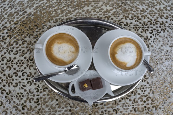 Two cappuccinos on a bistro table, Bavaria, Germany, Europe