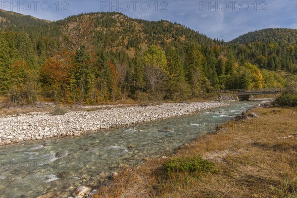 Bridge over the Rißbach in Rißtal, riverbed with scree, Karwendel nature park Park in autumn,