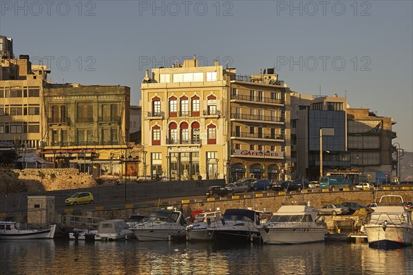 Morning light, boats, houses, harbour, blue sky, Heraklion, capital, island of Crete, Greece,