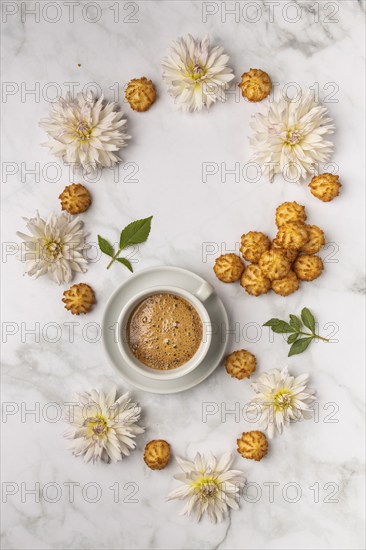 Food photography, coffee cup, with sweets and white dahlias (Dahlia), from above