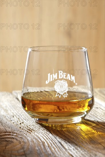 March 28, 2019, Minsk, Belarus, sniffer glass with kentucky straight bourbon whiskey on wooden