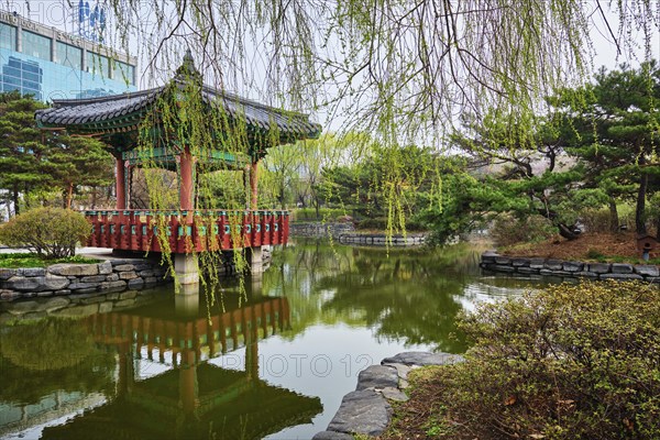 SEOUL, SOUTH KOREA, APRIL 8, 2017: Yeouido Park public park pond with pavilion summerhouse in