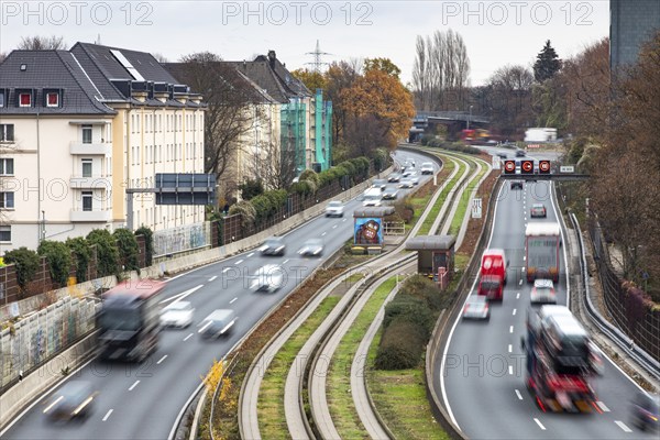 Motorway A40, Ruhrschnellweg, skyline of the city centre of Essen, exit Essen-Huttrop, track bus