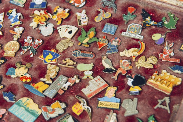 Antique badges, pins at flea market