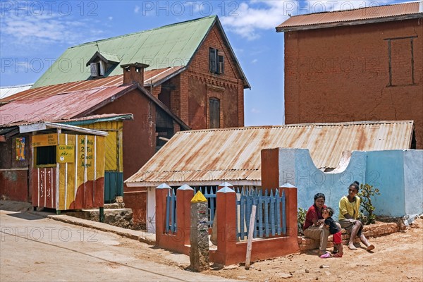Malagasy girls with child in street in the village Ambohimanga Rova near Antananarivo, Analamanga
