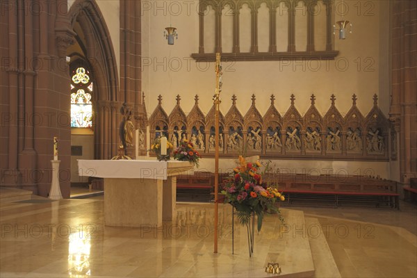 Interior view of the chancel with altar and figures row of the neo-Gothic St. Peter's Church,
