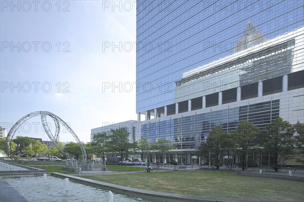 Sculpture Synergy by Christian Herdeg 1997 with reflection of Pollux and Kastor, glass building,