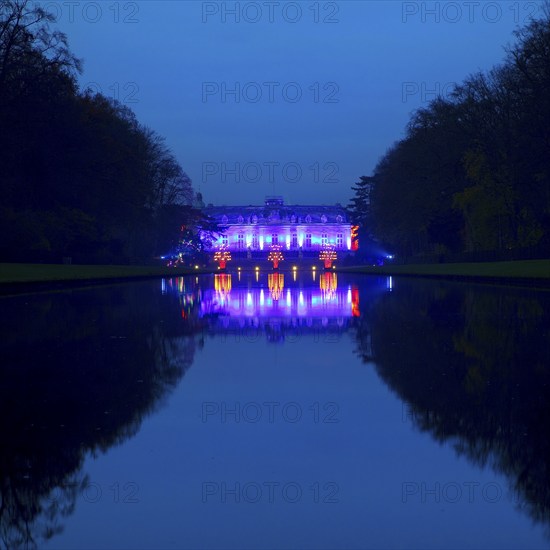 Illuminated Benrath Palace in the evening with the mirror pond at Christmas Wunderwelt, Düsseldorf,
