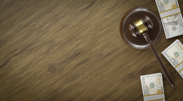 Overhead of gavel resting on a table and stacks of thousands of dollars with room for text