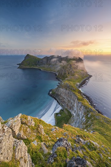 View from Håheia or Håen mountain to mountains and coast, evening mood, Måstad peninsula, Værøy