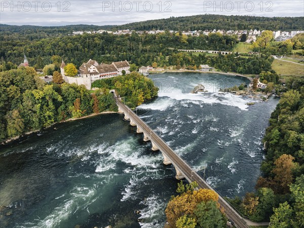 Aerial view of the Rhine Falls with railway viaduct and Laufen Castle in autumn, Neuhausen, Canton