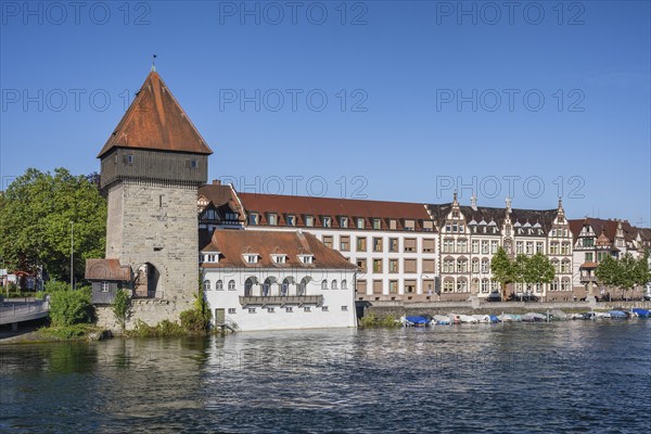 View from the old Rhine bridge to the banks of the Rhine with the historic Rhine gate tower in the