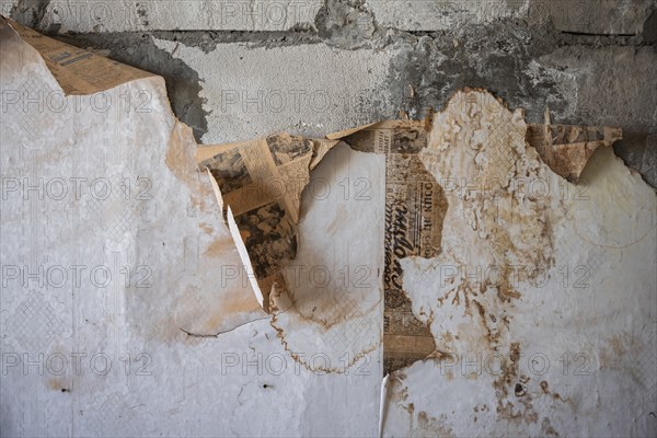 Peeling wallpaper, abandoned destroyed room in a residential building, Soviet apartment blocks,