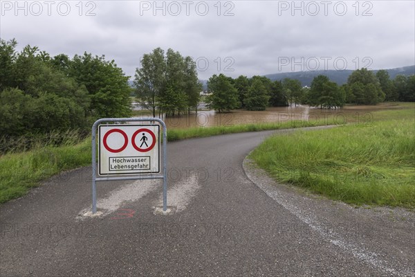 Symbolic image extreme weather, global warming, climate change, information board, flood retention