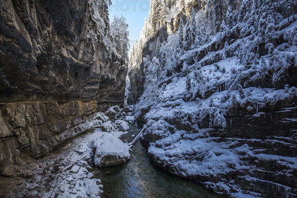 Winter, snowy landscape, river Breitach and hiking trail through the Breitachklamm gorge near