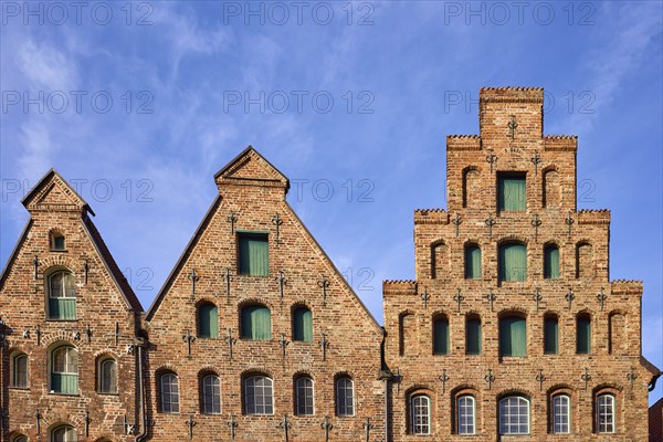 Historic salt warehouse, brick building, gable against blue sky with veil clouds, Hanseatic city of