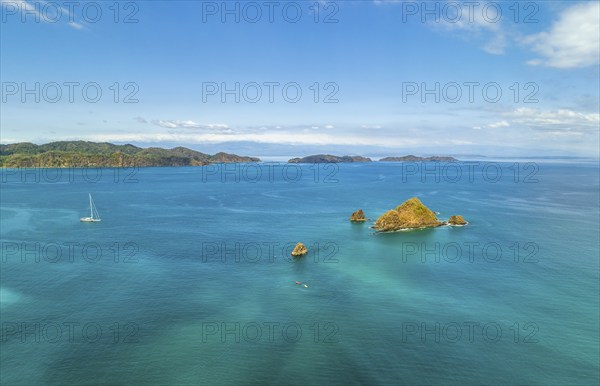 Aerial view, tropical islands and sailing boat in the turquoise ocean, Tortuga Island, Puntarenas,