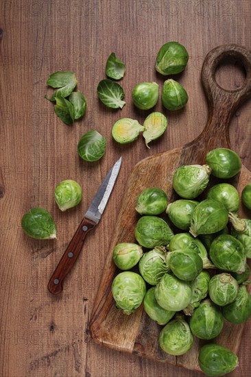 Fresh Brussels sprouts, raw, top view, on a wooden table, no people