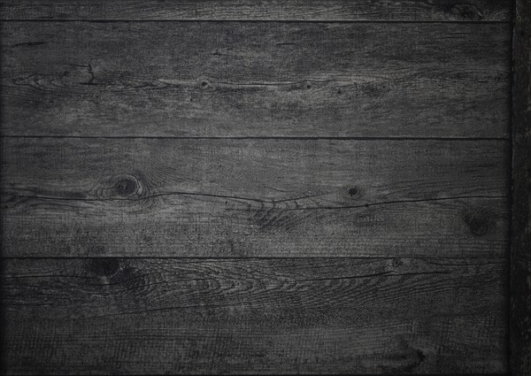The rich, dark wood surface features intricate grain patterns and textures, creating a warm and