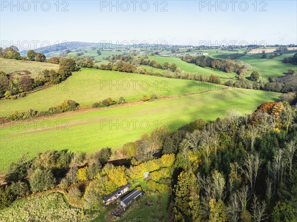 Fields and Farms over Skenfrith Castle from a drone, Monmouthshire, Wales, England, United Kingdom,
