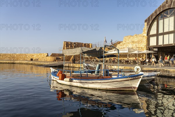 Fishing boat at the old Venetian harbour, Chania, Crete, Greece, Europe