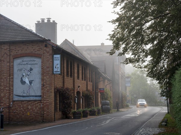 Schlepzig Brewery in the fog on Dorfstraße, Spreewald, Brandenburg, Germany, Europe