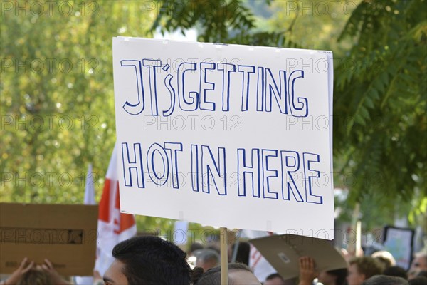 Heidelberg, Germany, September 2019: Protest sign cardboard saying Its getting hot in here during