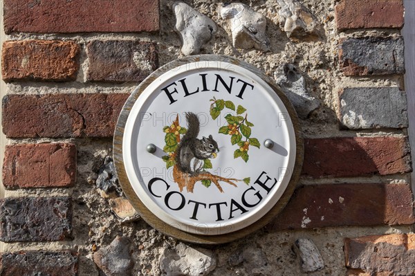 Painted tile on a house wall, Alfriston, East Sussex, England, Great Britain