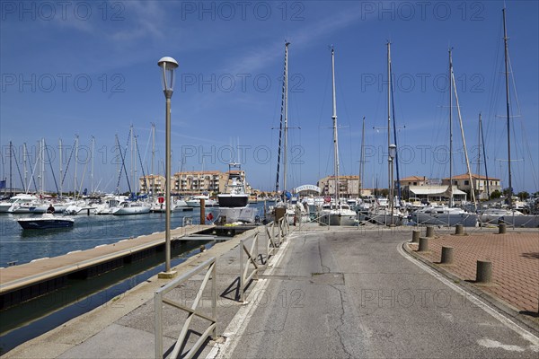 Road through the harbour of Frontignan, Hérault, Occitania, France, Europe