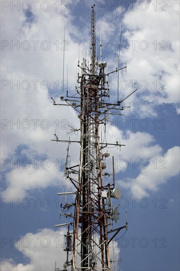Overloaded antenna mast, here in Naples, Campania, Italy, Europe