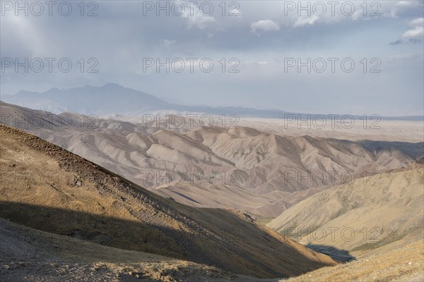 View of mountain landscape at Tyibel Pass, Song Kul Too mountain range, Naryn region, Kyrgyzstan,