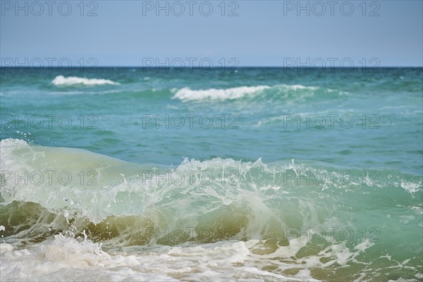 Breaking waves on a sandy beach, sunny, near Tarragona, Catalonia, Spain, Europe