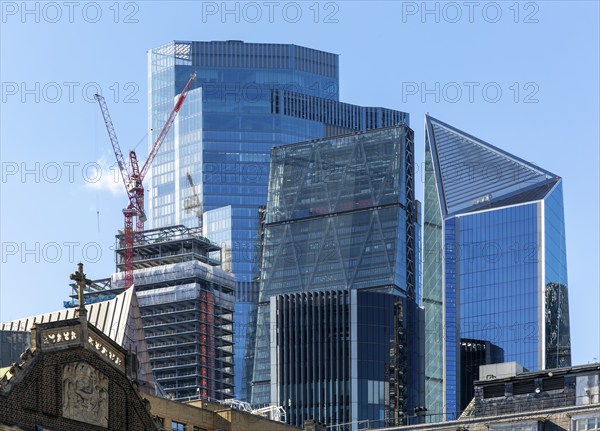 Cranes construction work high rise buildngs in financial district, City of London, England, UK