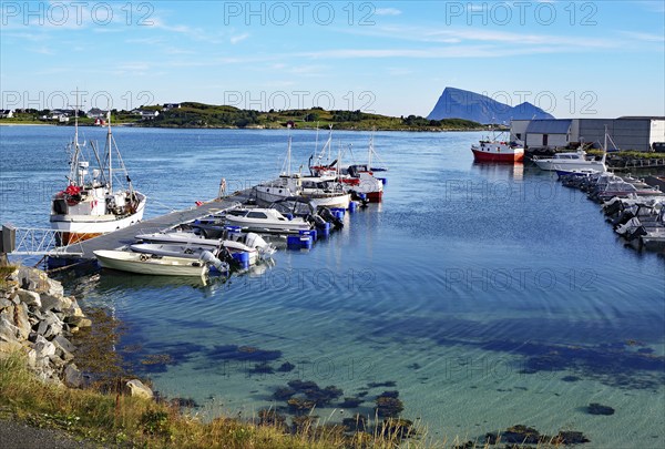 Crystal clear bays and sandy beaches on Sommarøy, small pleasure boats and fishing boats, summer,
