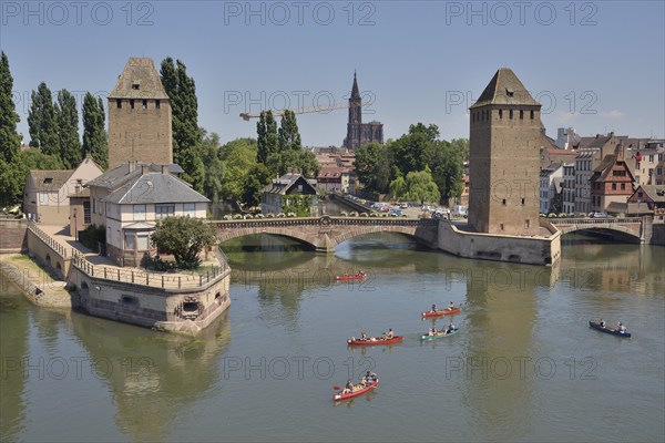 Canoeists on the River Ill at the Ponts Couverts bridge with the towers, UNESCO World Heritage