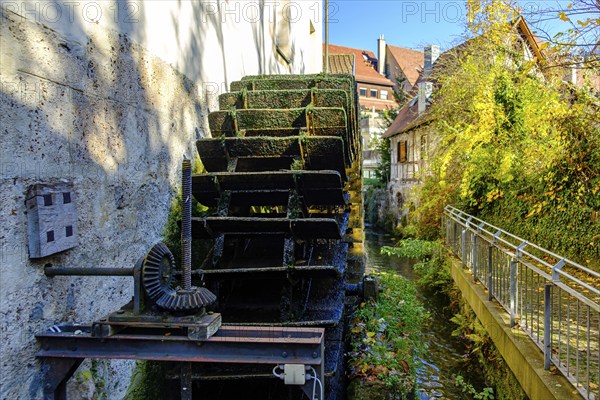 Symbolic image of historical mill wheel and concept of water energy and sustainability, here using