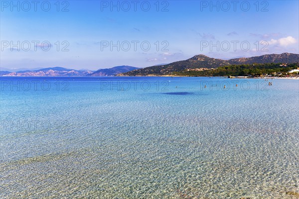 Turquoise blue clear water, coastline with hills on the horizon, L'Île-Rousse, Ile Rousse,