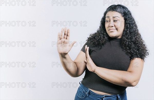 Displeased young woman rejecting with palms hands isolated. Disgusted young woman with rejection