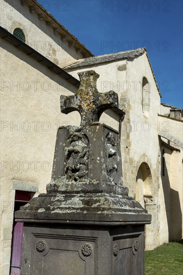 Artonne. Cross stone in front of Saint Martin church. Puy de Dome department. Auvergne Rhone Alpes.
