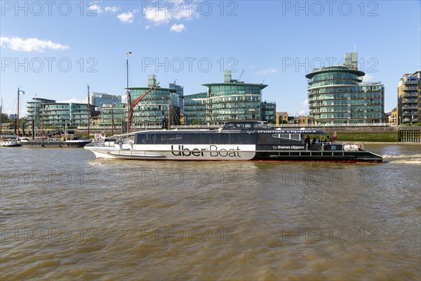 Uber boat by Thames Clippers, River Thames water bus transport service, Wapping, London, England,