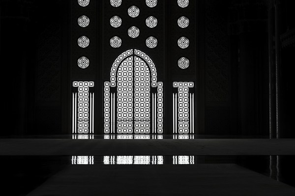 Light incidence in the darkness, interior door and window, arabesque, ornaments in the Hassan II