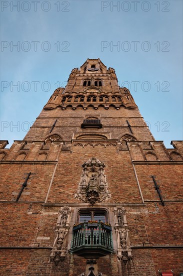 Brugge Belfry tower facade of famous tourist destination at Grote markt square in Bruges, Belgium