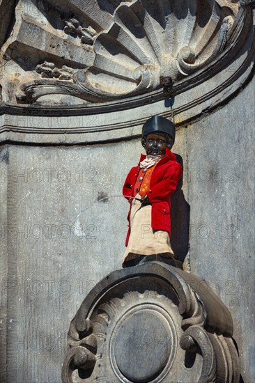 Brussels, Belgium, May 29, 2018: Famous tourist attraction of Brussels, dressed Manneken Pis statue