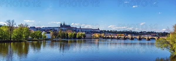 Panorama view of Charles bridge over Vltava river and Gradchany Prague Castle and St. Vitus