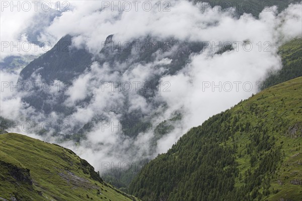 Low hanging clouds hanging over the Mölltal, Moelltal valley in summer, Hohe Tauern National Park,