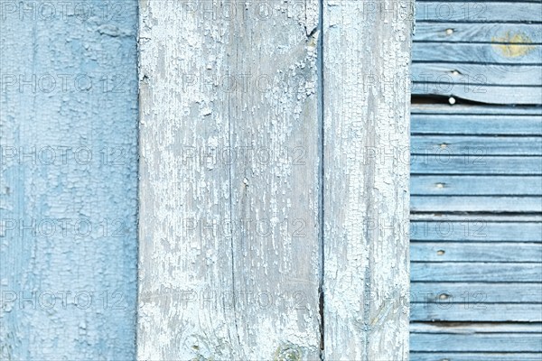 Abstract wooden background. Cracked paint on the wall